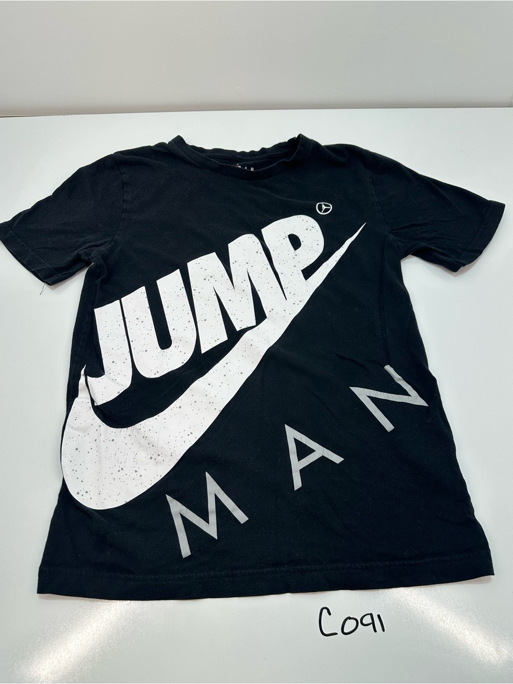 Jordan Black Tee with White Jump Graphic
